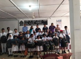 provide school supplies to children of migrant families